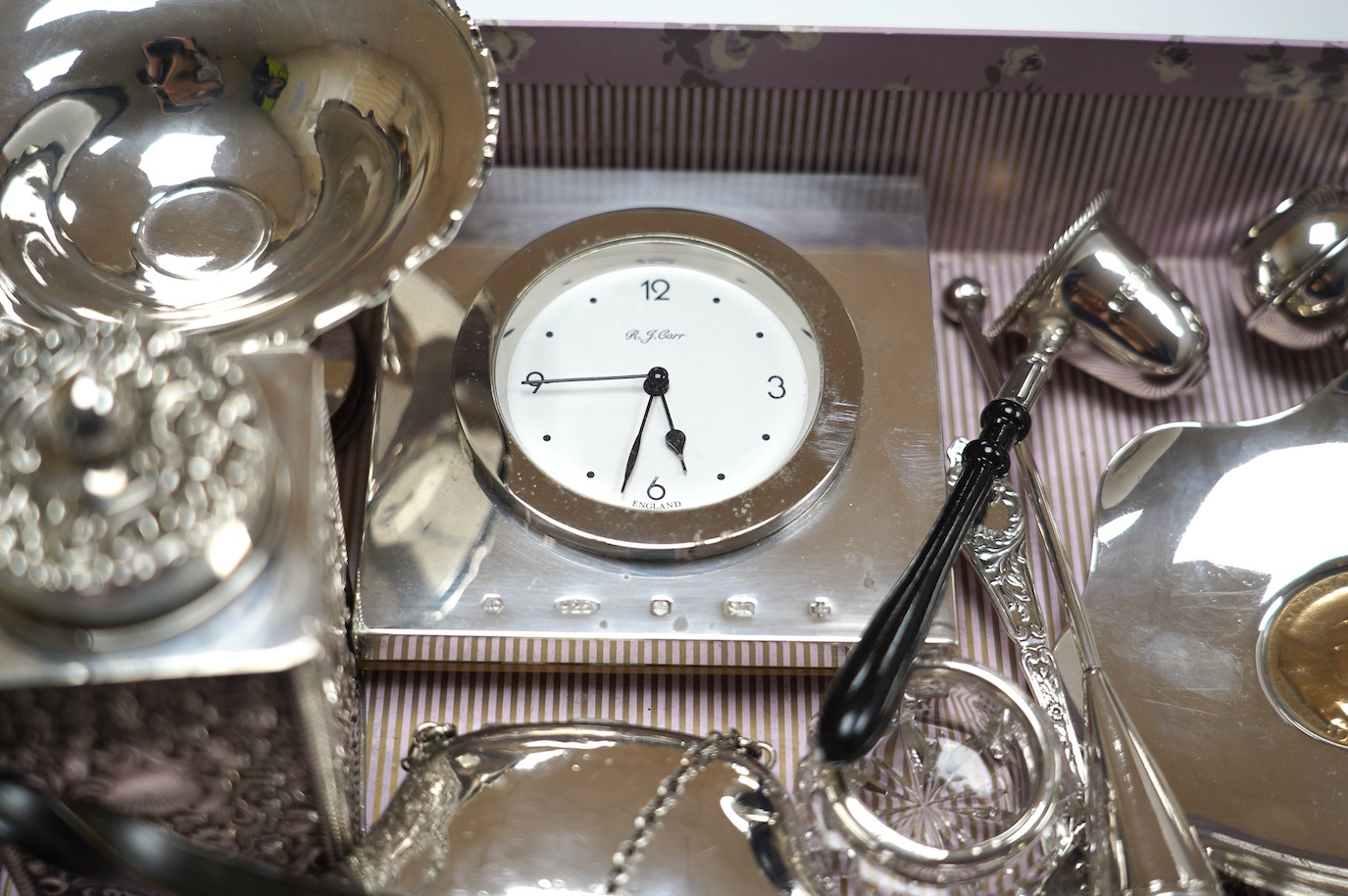 Sundry small silver including a late Victorian silver tea caddy (lid stuck), purse, tazza, modern timepiece, dish with inset coin, extinguisher, toddy ladle etc. and two plated items. Condition - poor to fair to good
